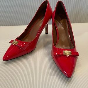 Cole Haan Red Patent Leather Pumps with bow and leather buckle.
